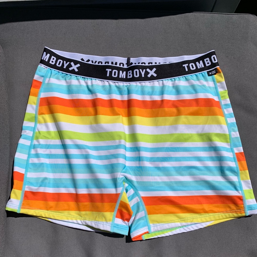 TOMBOY X Swim 4.5” shorts. Sunset stripes
